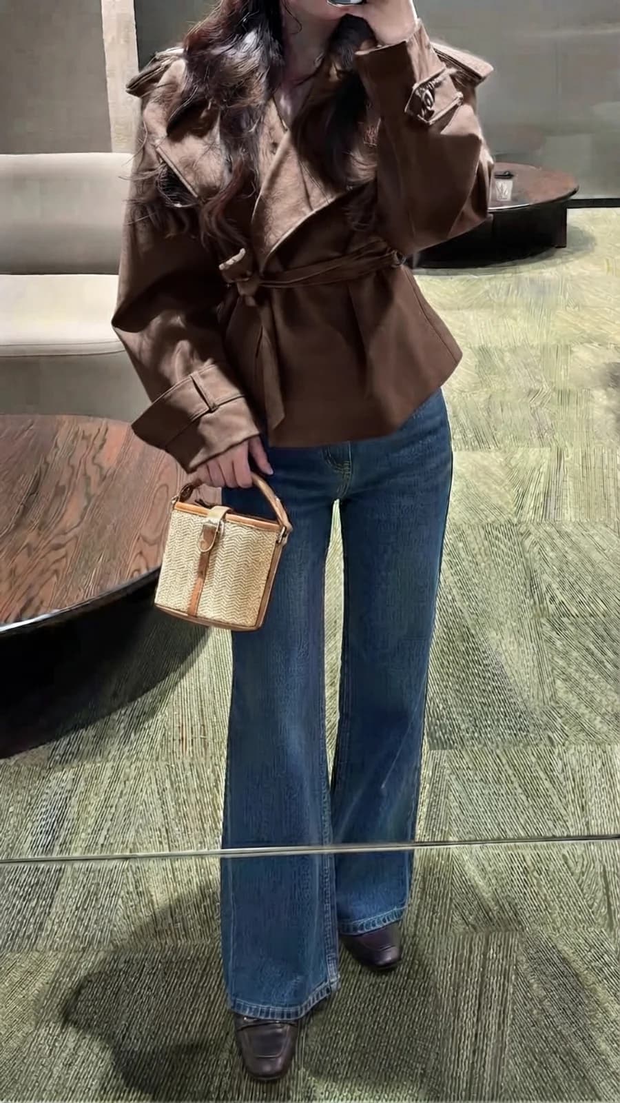 Women's autumn outfit: chocolate belted jacket with wide-leg denim and brown loafers