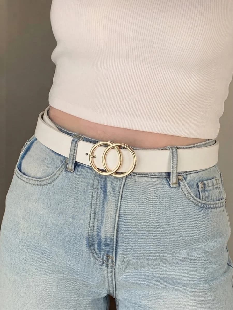 Women's white leather belt with a gold double-ring buckle worn with light-wash jeans and a white crop top