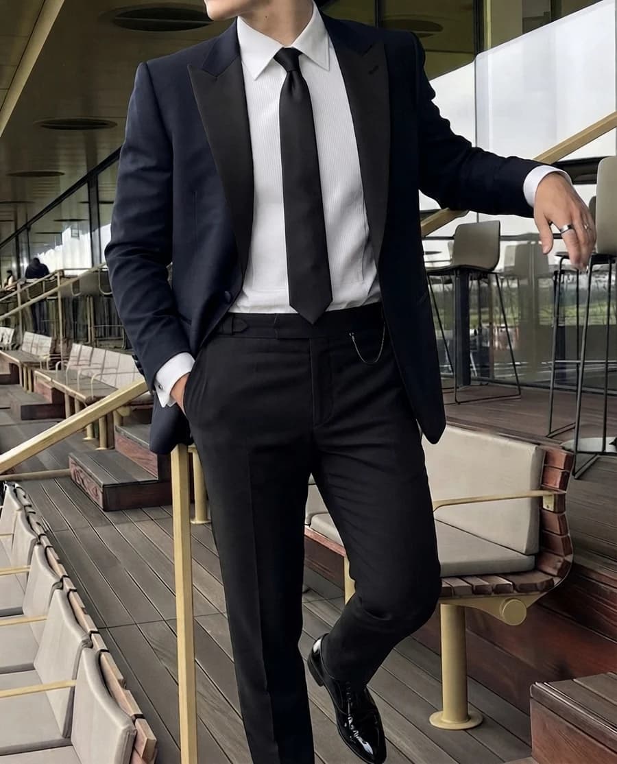 Black tie translated: midnight dinner jacket with satin peak lapels, white dress shirt and black necktie