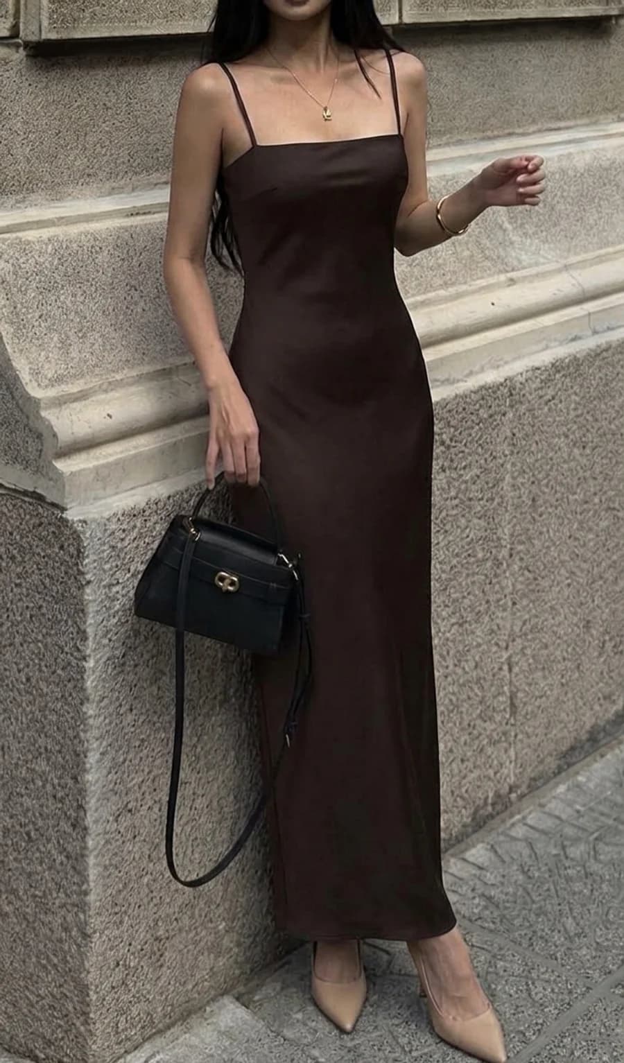 Dinner date outfit: chocolate brown column slip dress with nude pumps and a structured black bag