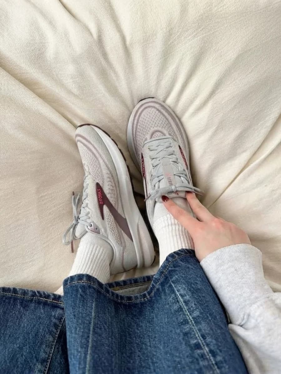 Women's light grey running shoes with blue denim and white socks