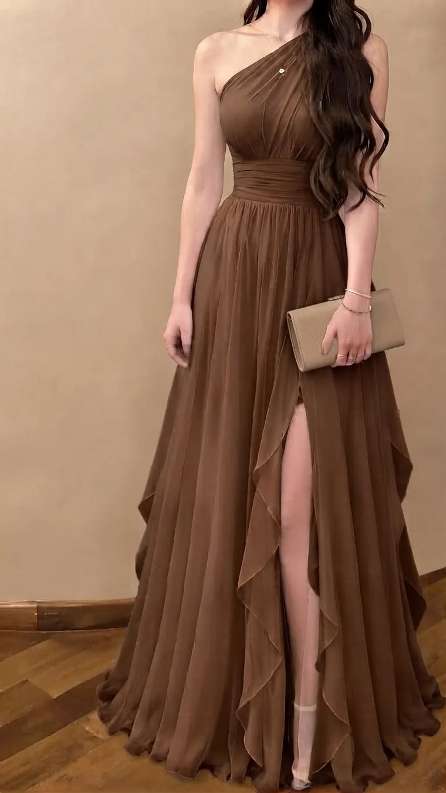 Black tie wedding guest outfit: chocolate brown one-shoulder floor-length gown with ruffled skirt