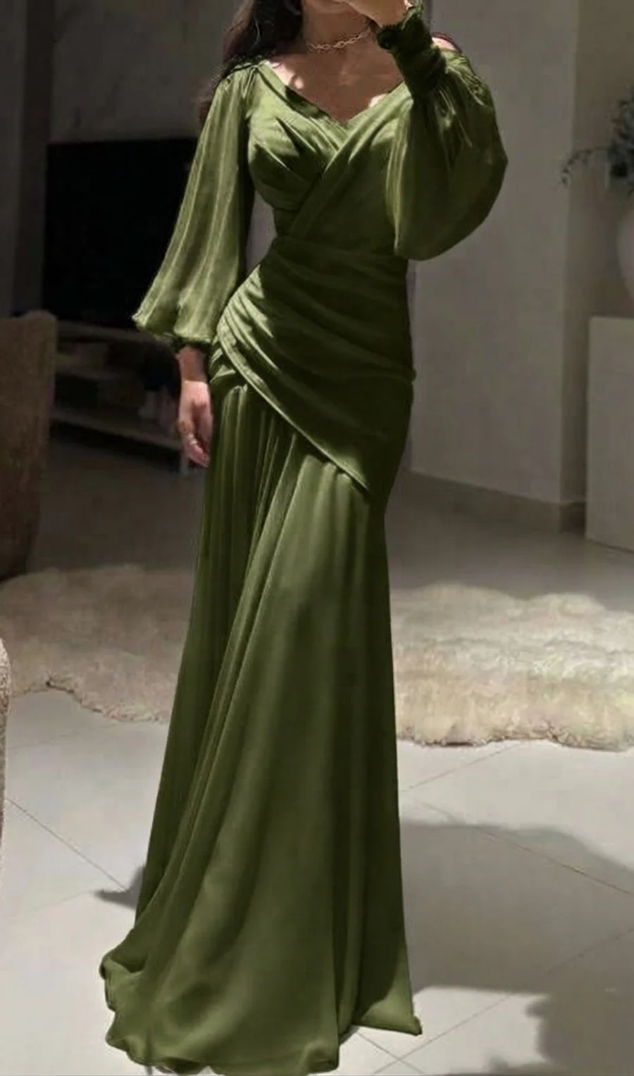 Wedding guest outfit: olive green silk gown with bishop sleeves and a ruched wrap bodice