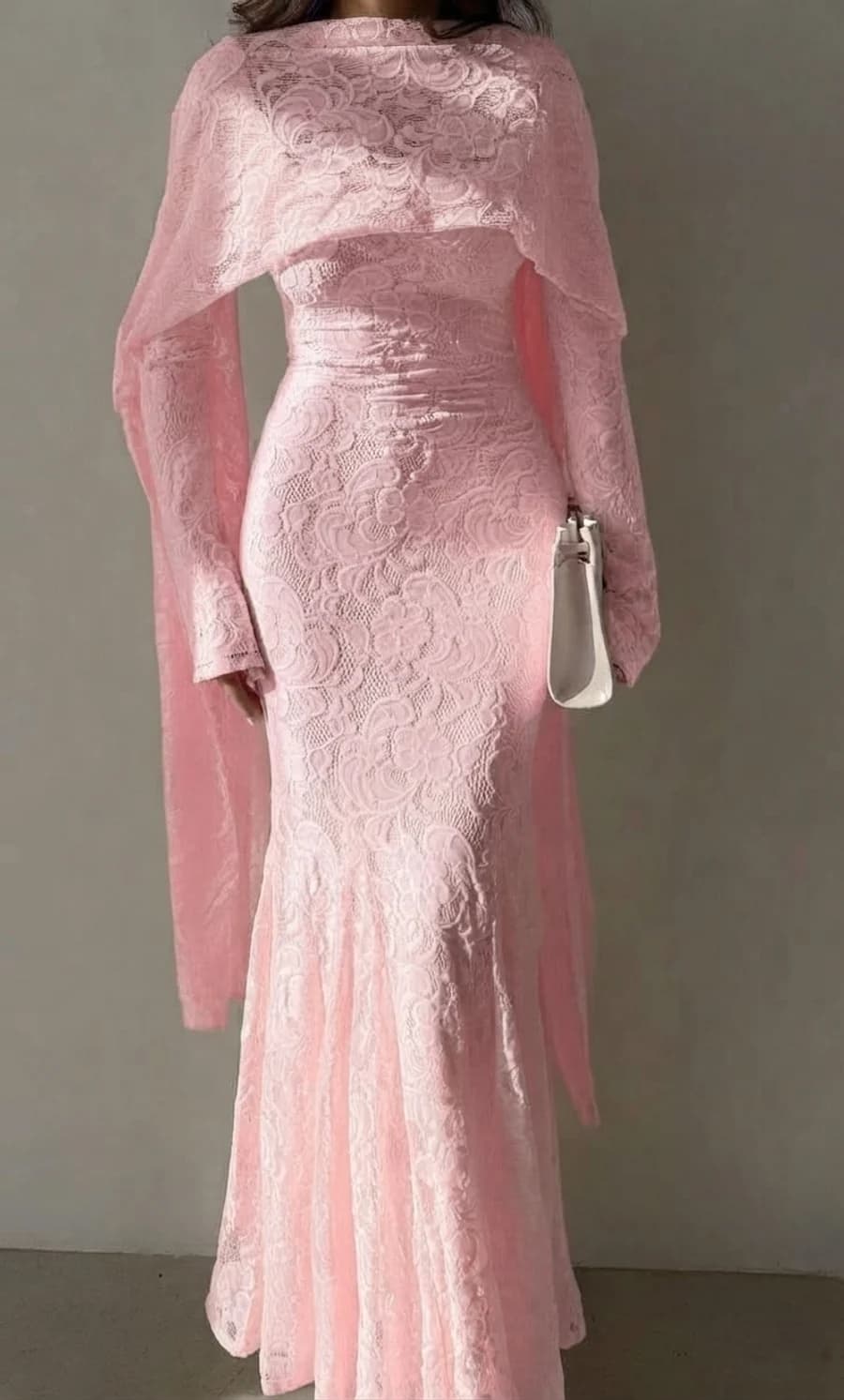 Semi-formal wedding guest outfit: blush pink floral lace mermaid dress with a matching capelet