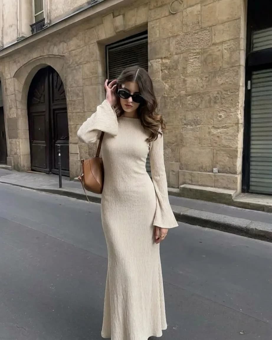 Cream ribbed knit dress with long sleeves and flared cuffs