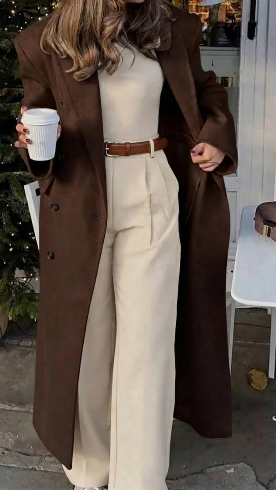 Editorial fashion portrait: chocolate wool coat over cream wide trousers