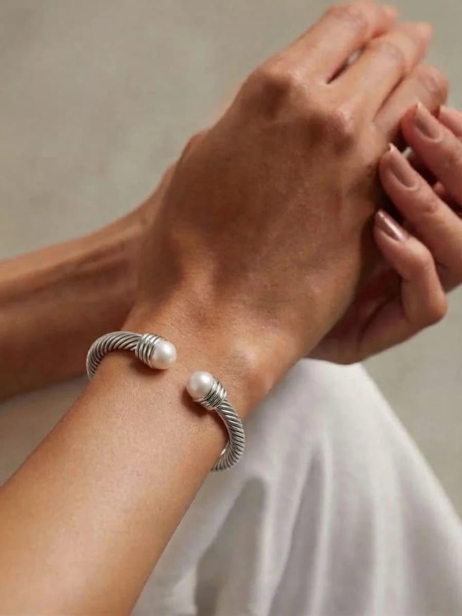 Silver twisted cable cuff bracelet with pearl end caps