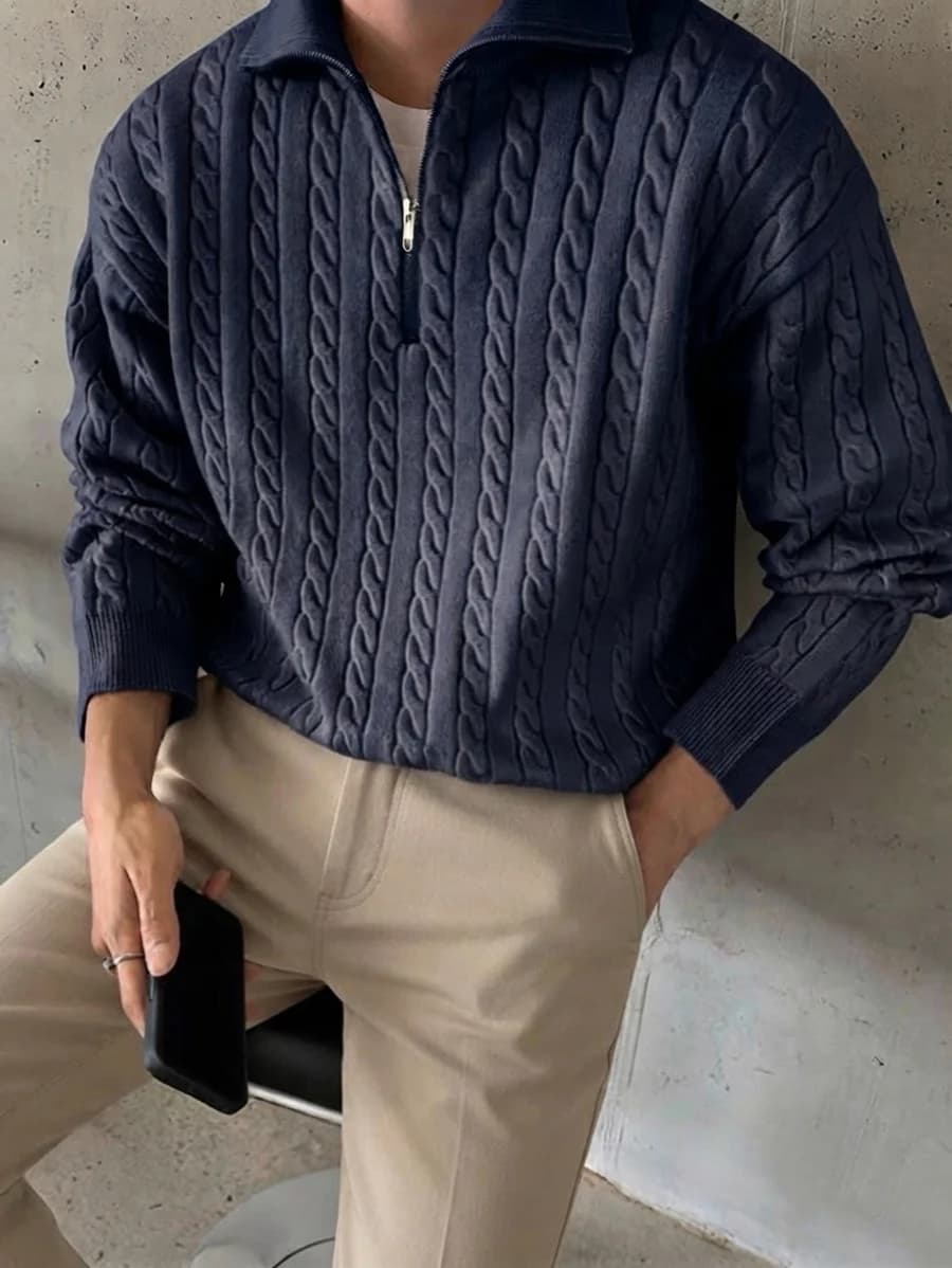 Office knitwear: navy cable-knit quarter zip over a white tee with khaki chinos