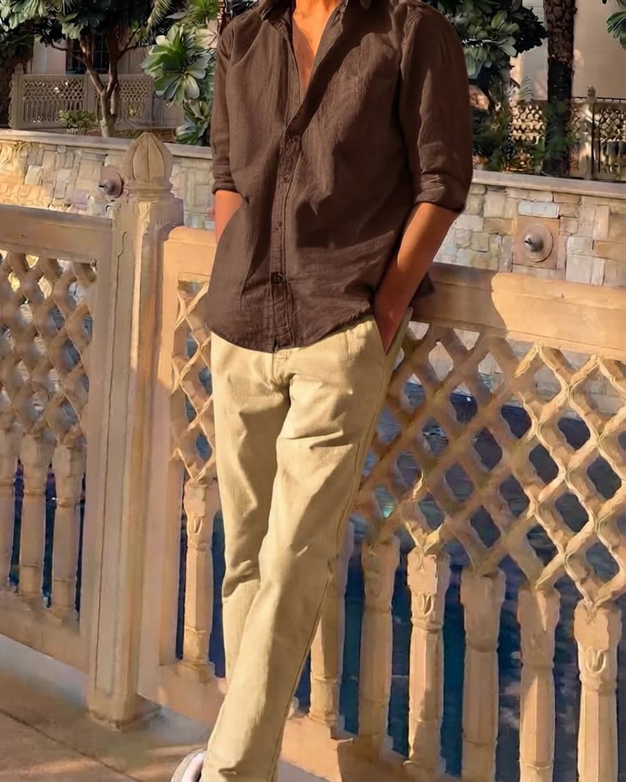 Smart streetwear: chocolate brown linen shirt with rolled sleeves, khaki chinos and white sneakers