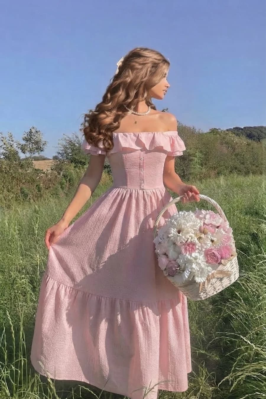 Women's summer outfit: pale pink off-shoulder tiered maxi dress in a meadow